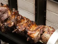Grilled chops roasting on a skewer