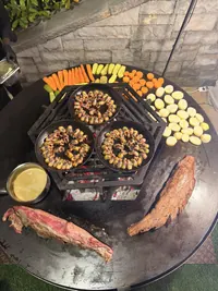 Overhead view of vegetables and pans on the grill