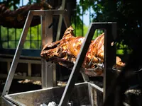 Lamb roasting above a wood-fired brazier