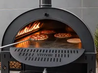 Pizzas baking in a wood-fired oven